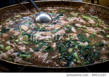 Fried noodle with pork and broccoli in pot. 90012287