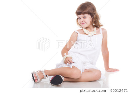 Beautiful little girl with white copy space on a white background Beautiful little girl with white copy space on a white background 90012471