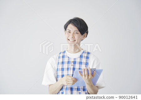 Nursery teacher talking on a white background Nursery teacher talking on a white background 90012641