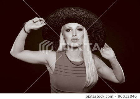 Beautiful Young Caucasian Woman, In Her Twenties, With Blonde Hair, Wearing Sexy Black Lingerie And Stockings, Isolated On black 90012840