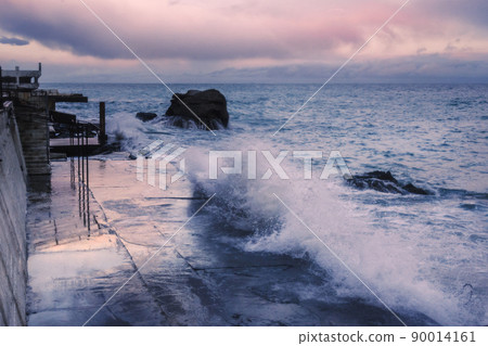 Black Sea in rainy stormy weather at sunset in Alupka, Crimea Black Sea in rainy stormy weather at sunset in Alupka, Crimea 90014161