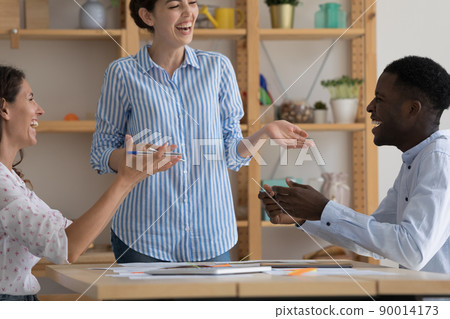 Cheerful excited diverse business team friends brainstorming on meeting 90014173