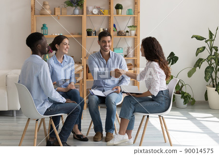 Happy diverse business team employees shaking hands at corporate meeting Happy diverse business team employees shaking hands at corporate meeting 90014575