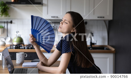 Burned out freelance employee girl suffering from heat 90014766