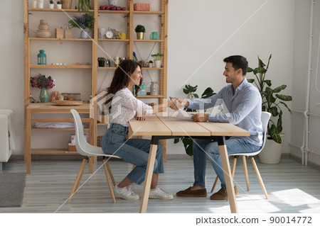 Happy business owner hiring job candidate after successful interview Happy business owner hiring job candidate after successful interview 90014772