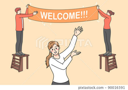 Happy people hanging welcome banner  90016391