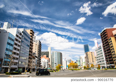 It is a street view near the intersection of Hiroshima Ekimae-dori. See the dramatic blue sky and clouds. Hiroshima city It is a street view near the intersection of Hiroshima Ekimae-dori. See the dramatic blue sky and clouds. Hiroshima city 90016770