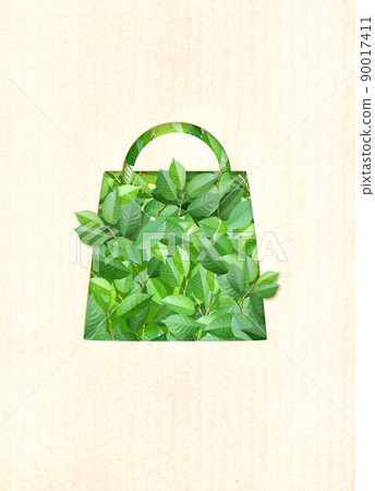 Responsible consumption. Green leaves and shopping bag in paper cut style 90017411