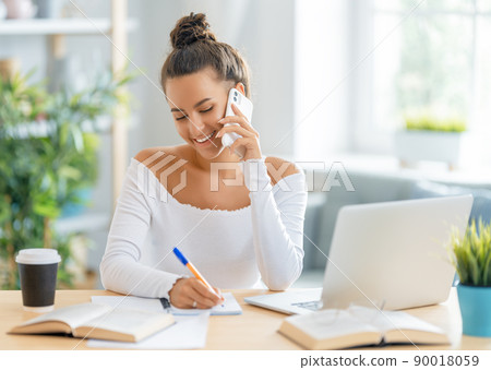 woman working on laptop at home 90018059
