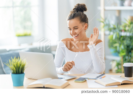 woman working on laptop at home 90018060