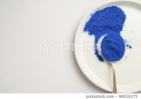 Butterfly pea flower powder or blue matcha, top view, copy space 90018375