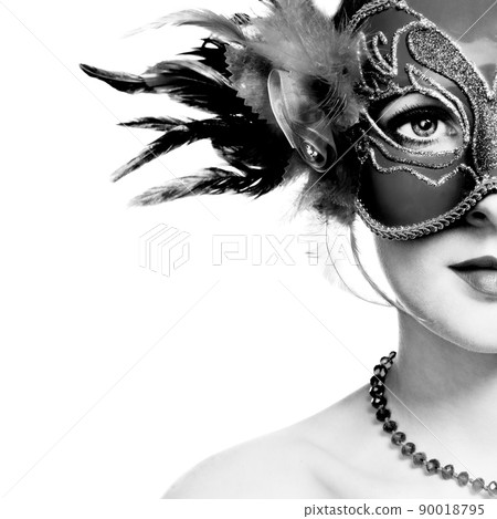 The beautiful young woman in mysterious venetian mask 90018795