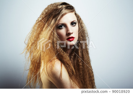 Fashion portrait of a young beautiful redhead woman 90018920