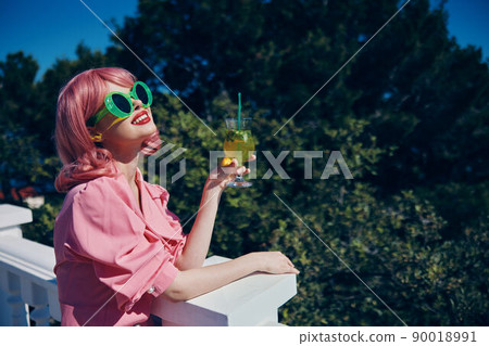 cheerful woman with pink hair summer cocktail refreshing drink Drinking alcohol 90018991