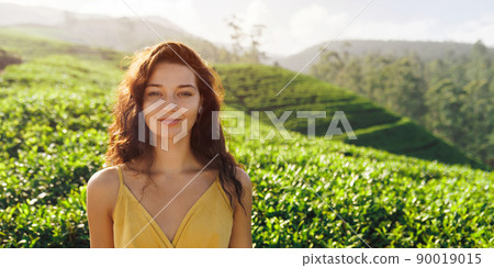 Woman Traveler Portrait Against the Tea Plantations Background 90019015
