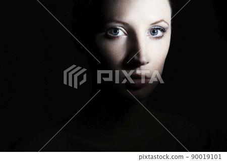 Mysterious portrait of a beautiful young woman Mysterious portrait of a beautiful young woman 90019101