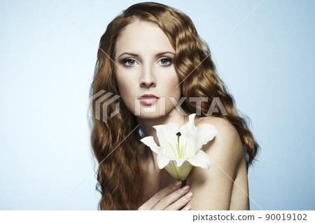 Beautiful portrait of young sensual woman with flower Beautiful portrait of young sensual woman with flower 90019102
