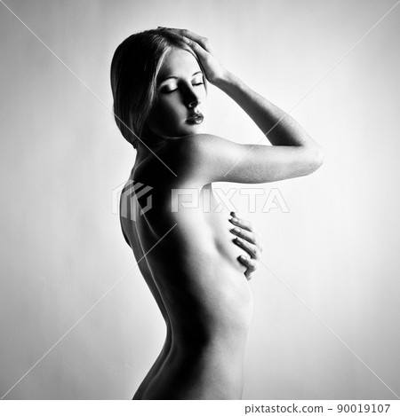 Fashion photo of beautiful nude woman. Black and white Fashion photo of beautiful nude woman. Black and white 90019107