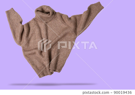 brown wool sweater, as if dancing, hands up, concept, on a lilac background 90019436