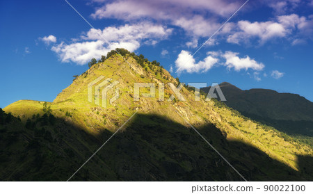 Colorful landscape with high Himalayan mountains, green forest 90022100