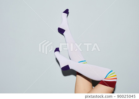 Playful Girl in Knee Socks Playful Girl in Knee Socks 90025045