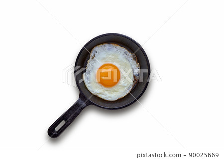 Fried egg in a small skillet with a stand, a bunch of dill, tomatoes Fried egg in a small skillet with a stand, a bunch of dill, tomatoes 90025669