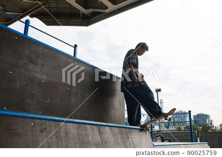 Skateboarder on Ramp Skateboarder on Ramp 90025759