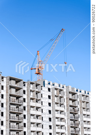 Industrial landscape with silhouettes of cranes on the blue sky background Industrial landscape with silhouettes of cranes on the blue sky background 90026722
