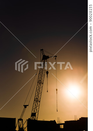 silhouette tower crane of construction site at sunset silhouette tower crane of construction site at sunset 90028155