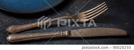 Cutlery on black. A fork and a knife, silverware on a dark background 90028250