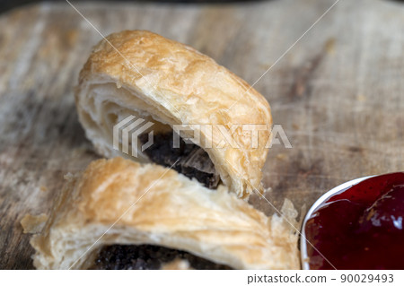 puff pastry bun made of wheat dough and poppy seed filling puff pastry bun made of wheat dough and poppy seed filling 90029493