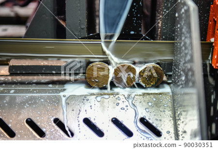 Industrial metal working cutting process The raw material bar clamping on the CNC lathe machine Industrial metal working cutting process The raw material bar clamping on the CNC lathe machine 90030351