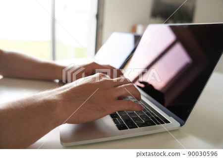 The concept of remote work. Close-up of male hands typing on the keyboard in search of information. A freelance copywriter is working on a project. High quality 4k footage The concept of remote work. Close-up of male hands typing on the keyboard in search of information. A freelance copywriter is working on a project. High quality 4k footage 90030596