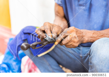 close up of afro american artisan hands carving wood close up of afro american artisan hands carving wood 90030651