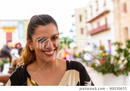 Portrait of a latina woman in a sunny day 90030655