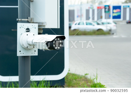 Modern CCTV camera at the entrance to the car park Modern CCTV camera at the entrance to the car park 90032595