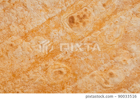Mexican tomato flavored wheat tortilla wraps texture background 90033516