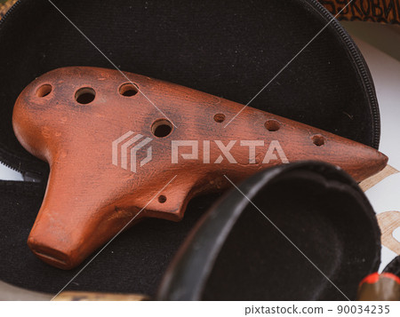Ocarina wind musical instrument type of vessel flute. Various ukraininan traditional ethnic folk music festival. 90034235