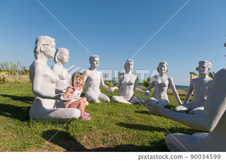 Cute baby girl playing in the park Cute baby girl playing in the park 90034599
