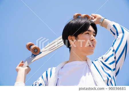 Blue sky, skateboard and men 90036681