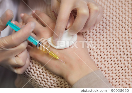 Doctor doing stem cell therapy on a patient's elbow after the injury. Treating knee pain with platelet-rich plasma injection. Treatment of arthritis and osteoarthritis.Medical and cosmetology concept. Doctor doing stem cell therapy on a patient's elbow after the injury. Treating knee pain with platelet-rich plasma injection. Treatment of arthritis and osteoarthritis.Medical and cosmetology concept. 90038660