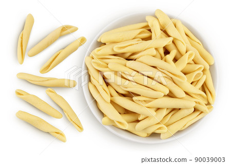 Typical Calabrian pasta called Maccheroncini or Maccheroni in ceramic bowl isolated on white background with clipping path. Top view. Flat lay 90039003
