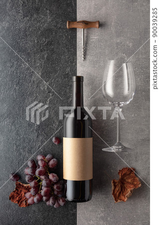 Red wine with grapes on a stone background. Red wine with grapes on a stone background. 90039285