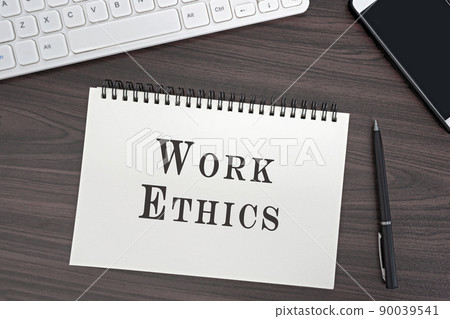 Top view and flat lay of office desk and notepad with Work Ethics word. Top view and flat lay of office desk and notepad with Work Ethics word. 90039541