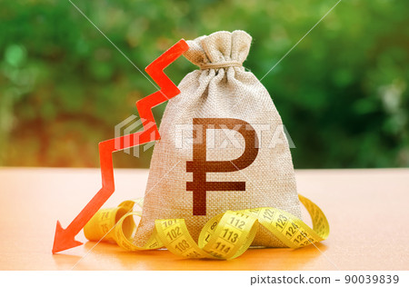 Russian ruble money bag with down arrow and measure tape. Reduced wages, cuts in social benefits. Cutting costs, saving. Decrease in discount rate by national bank. Falling wages and welfare. 90039839
