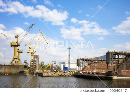 Shipyard in Szczecin seen from the water, Poland. Shipyard in Szczecin seen from the water, Poland. 90040247