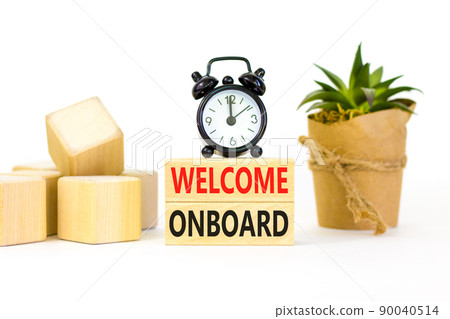 Welcome onboard symbol. Concept words Welcome onboard on wooden blocks on a beautiful white table white background. Black alarm clock. Business onboarding and welcome onboard concept, copy space. 90040514