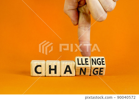 Chance or challenge symbol. Businessman turns wooden cubes and changes the concept word challenge to chance. Beautiful orange table orange background. Business challenge or chance concept. Copy space. Chance or challenge symbol. Businessman turns wooden cubes and changes the concept word challenge to chance. Beautiful orange table orange background. Business challenge or chance concept. Copy space. 90040572