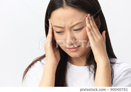 SARS CoVID symptoms. Tormented tanned beautiful young Asian lady touch forehead feel elevated temperatures posing isolated on white background. Injuries Poor health Illness concept. Cool offer Banner SARS CoVID symptoms. Tormented tanned beautiful young Asian lady touch forehead feel elevated temperatures posing isolated on white background. Injuries Poor health Illness concept. Cool offer Banner 90040781