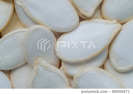 Heap of green pumpkin seed: close up, top view 90040871